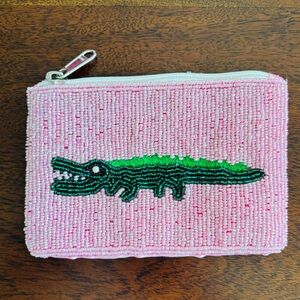 Pink Beaded Pouch with Green Crocodile Design. 
Wallet/pouch.